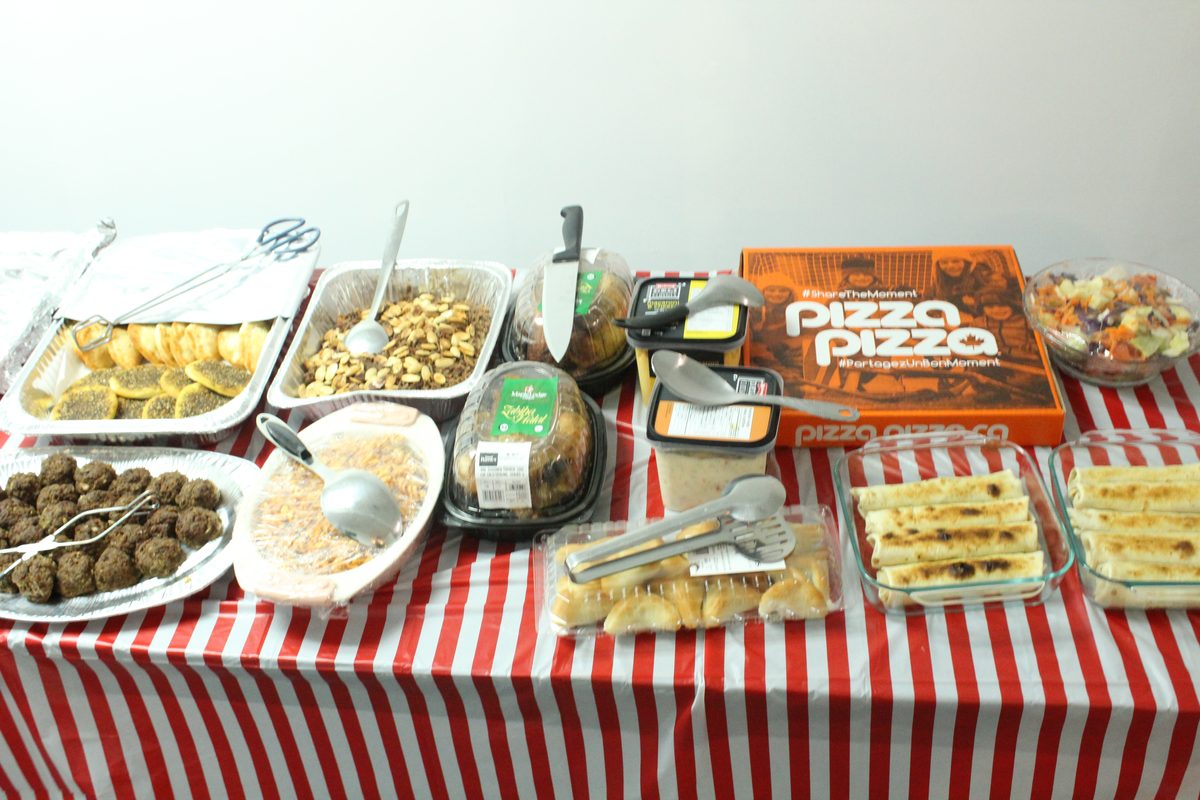 Dishes from many different kitchens laid out at a Community Matters Mississauga community meal
